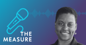 Black and white photo of Dr. Lisa Fitzpatrick smiling and looking at the camera, placed on a background with a soundwave depiction. To the left of the photo is the name of the podcast, The Measure, with a blue microphone connected to the 'T'.
